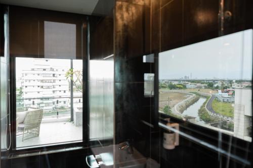 a room with a window with a view of a street at Tsang Kuo Resort in Wujie