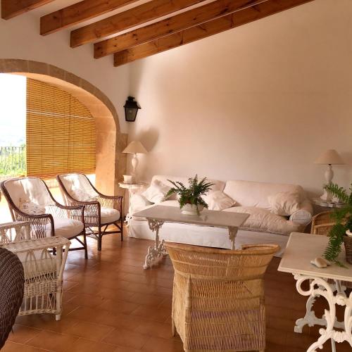 a living room with a couch and chairs at Seaside villa in Jávea with private pool in Jávea