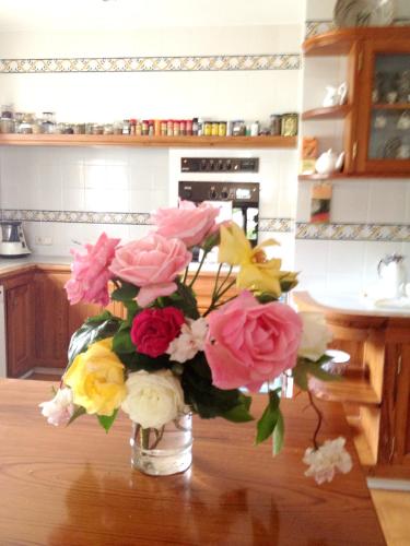 a vase of flowers on a table in a kitchen at Seaside villa in Jávea with private pool in Jávea