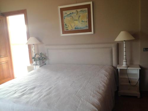 a bedroom with a white bed and a window at Seaside villa in Jávea with private pool in Jávea