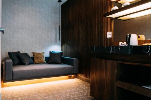 a couch sitting in a room with a fireplace at Tsang Kuo Resort in Wujie