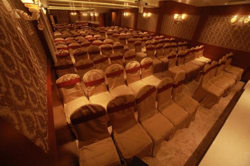 an auditorium with rows of chairs in a theater at THE HOTEL PARK in Kolachel