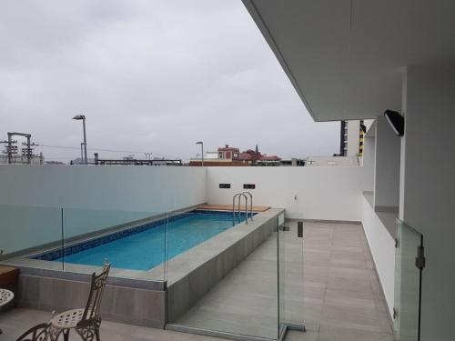 a swimming pool on the roof of a building at 1-on-Albert Studio Apartments in Cape Town