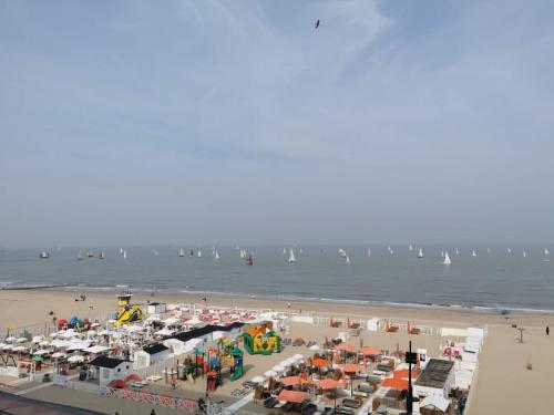 a beach with a bunch of sail boats in the water at studionusi in Blankenberge