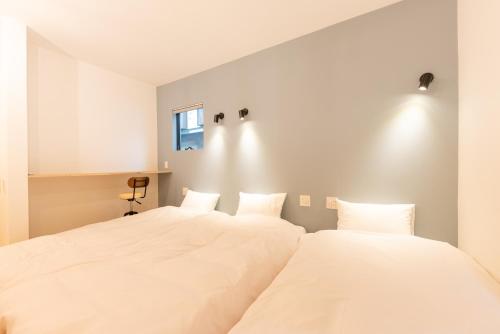 Una cama o camas en una habitación de 強羅base A棟 - GORA Base A