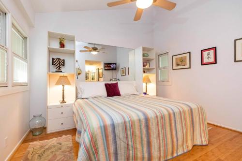 a bedroom with a bed and a ceiling fan at Makani A Kai Resort B-7 in Wailuku