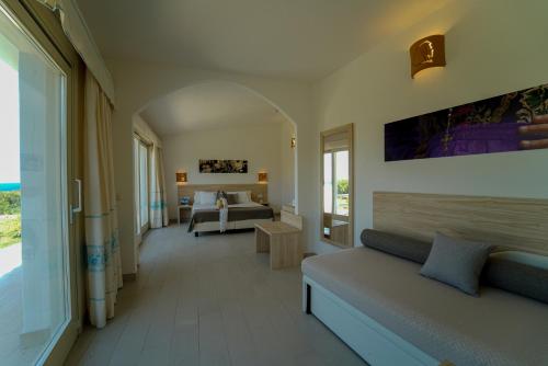 Postel nebo postele na pokoji v ubytování GH Santina Resort & SPA