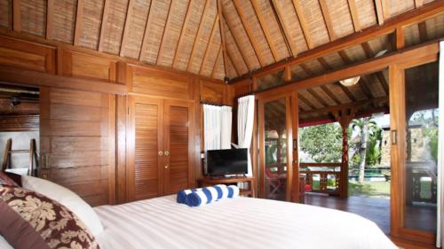 Postel nebo postele na pokoji v ubytování Villa Sindu Ubud