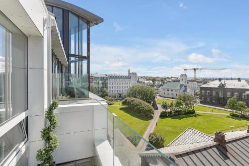 an apartment balcony with a view of a city at City Center Hotel in Reykjavík