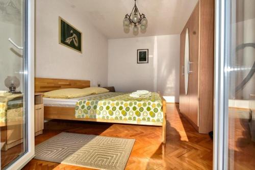 Postel nebo postele na pokoji v ubytování Apartments ZANA (77)