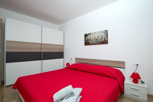 Postel nebo postele na pokoji v ubytování Apartments Lara