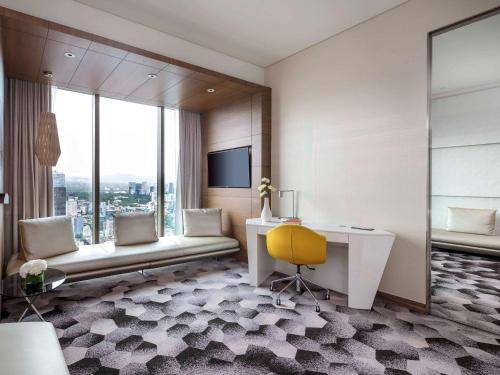 a hotel room with a desk and a window at Sofitel Mexico City Reforma in Mexico City