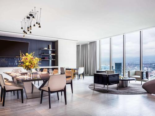 a dining room with a table and chairs at Sofitel Mexico City Reforma in Mexico City