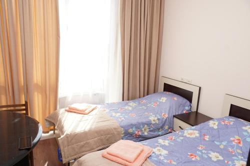 Panorama hotel on Baghramyan avenueにあるベッド