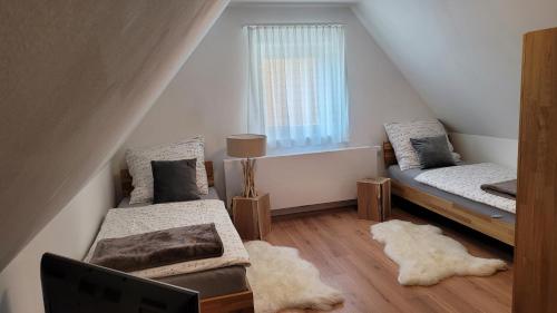 A bed or beds in a room at Gästehaus Sabine