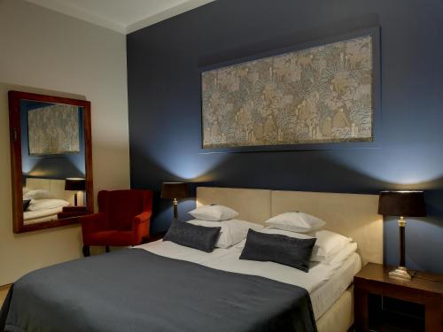 Postel nebo postele na pokoji v ubytování Hotel Szara Willa