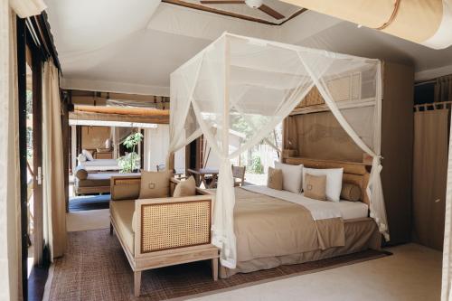 Voodi või voodid majutusasutuse Jawa Jiwa G-Land Resort toas