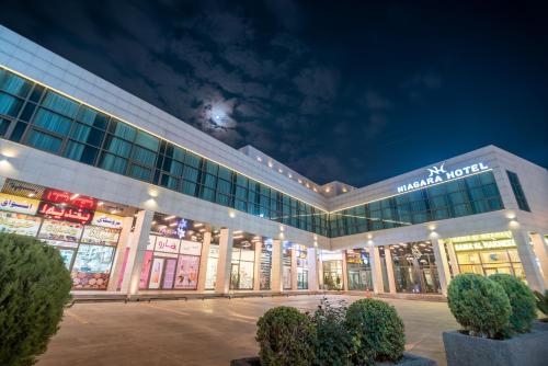 a store front of a shopping mall at night at Niagara Hotel Erbil in Erbil