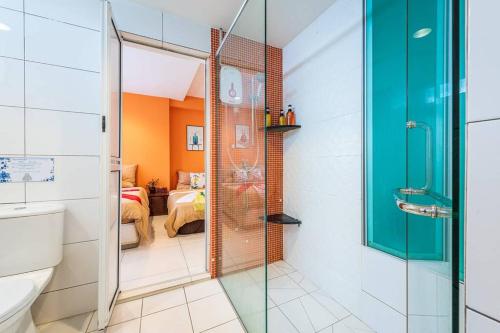 a bathroom with a glass shower and a toilet at Ancient Loft House - China Theme@ KL Bukit Bintang in Kuala Lumpur