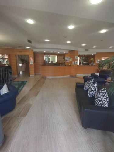 a large lobby with couches and tables and a unintention at HOTEL DUCA D'AOSTA in Mogliano Veneto