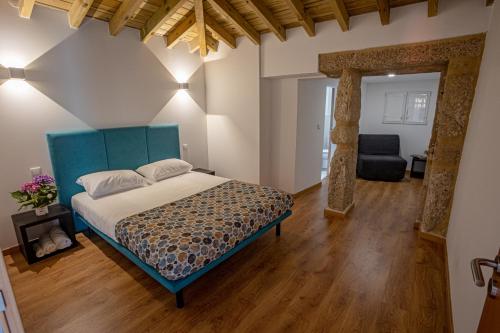 Ένα ή περισσότερα κρεβάτια σε δωμάτιο στο Casa da Clarinha, piscina, perto Sistelo e Ecovia do Vez