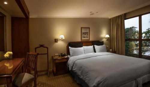 Windsor Hotelにあるベッド