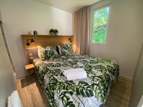 Кровать или кровати в номере Vakantiepark Walsdorf