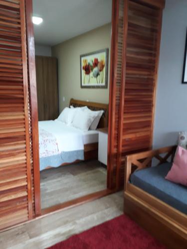 Un pat sau paturi într-o cameră la Espaço Kayan