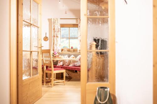 a dining room with a table and a window at Wellnessappartements Margit in Alpbach