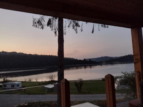 a view of a lake from a porch at Villa Solina in Zawóz