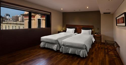 Windsor Hotelにあるベッド