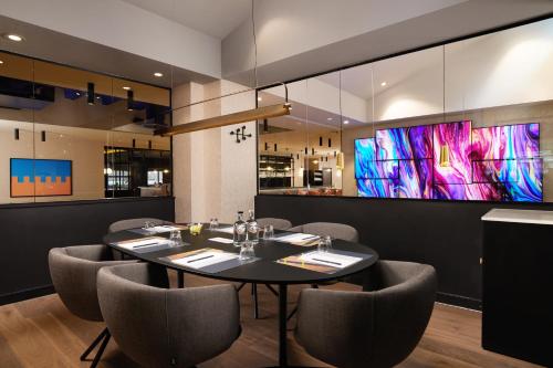 a dining room with a table and chairs at Malmaison York in York
