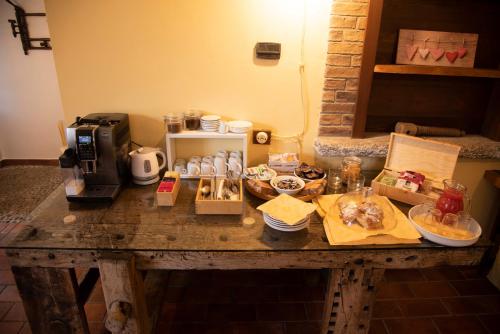 a table with food items on top of it at Agriturismo Cascina Costa in Cassago Brianza