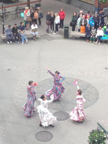 a group of women dancing in a street at Solsta Hotell in Karlstad