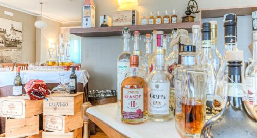 a room with many bottles of alcohol on a counter at Hotel Belvedere Thiene in Thiene