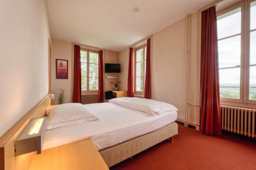 Krevet ili kreveti u jedinici u objektu Hôtel Le Funi de Cossonay