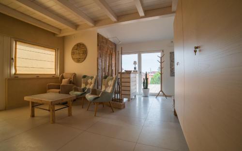 a living room with chairs and a table at RESIDENCE OLD STORIES in Barile