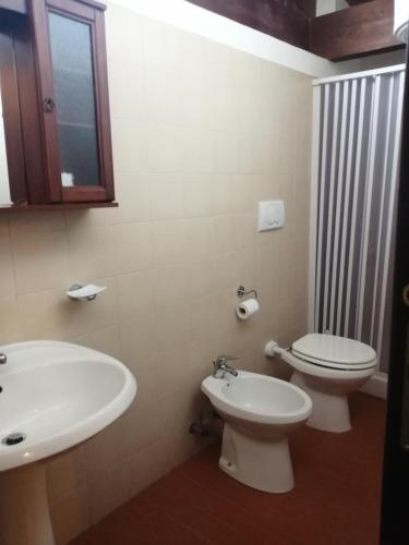 a bathroom with a toilet and a sink at Holiday Residence in Casamassima