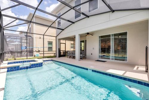 a swimming pool in a house with a building at Lovely Private Pool Villa wFREE Resort Access in Kissimmee