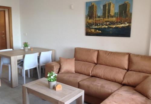 a living room with a couch and a table at Fantastic apartment in Torrevieja