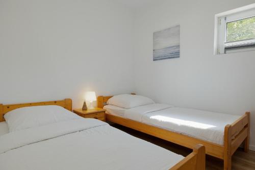 Giường trong phòng chung tại Baltic Center Bungalows