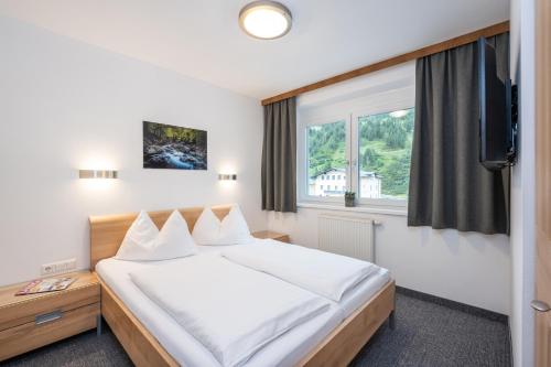 Posteľ alebo postele v izbe v ubytovaní Appartements Insieme