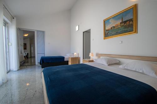 Postel nebo postele na pokoji v ubytování Apartments Lantina