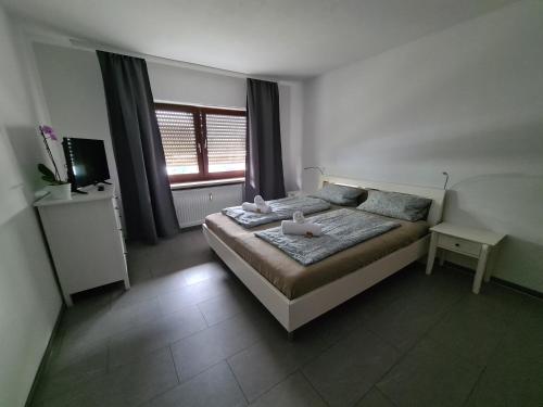 Postel nebo postele na pokoji v ubytování Ferienwohnung Schwetzingen