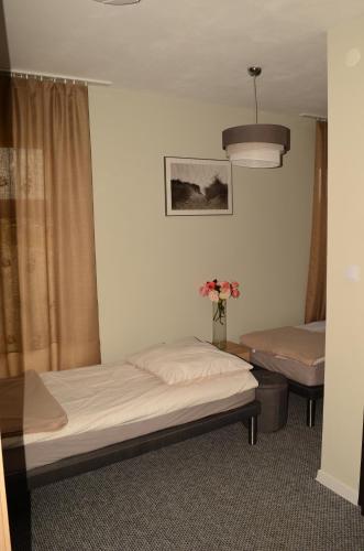 Ένα ή περισσότερα κρεβάτια σε δωμάτιο στο Kresovia