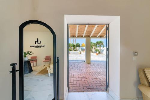 an open door to a room with a patio at Hacienda Soto-Hego Haizea in Chiclana de la Frontera