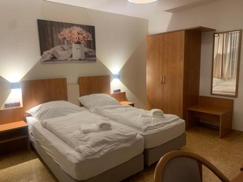 Ένα ή περισσότερα κρεβάτια σε δωμάτιο στο Hotel Gold´ne Krone