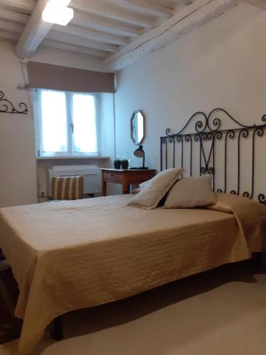 a bedroom with a large bed in a room at Una finestra sul mare - Appartamento a Fano in Fano
