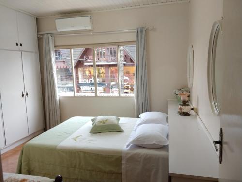 Katil atau katil-katil dalam bilik di Apartamento Augusto Zatti no centro