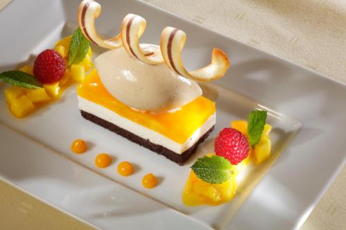 a dessert with a reindeer on a white plate at Schloss Eberstein in Gernsbach